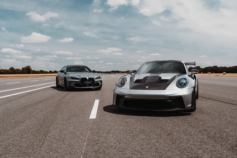 BMW M4 Competition et Porsche 911 GT3 RS Driver One en piste